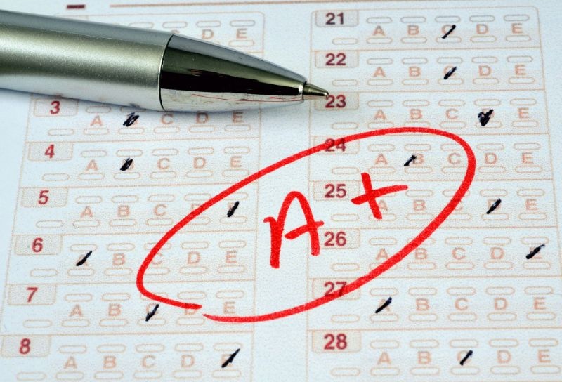 An image of an answer sheet for a test. There is an A+ written on the paper.